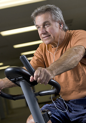 Man using exercise bike.